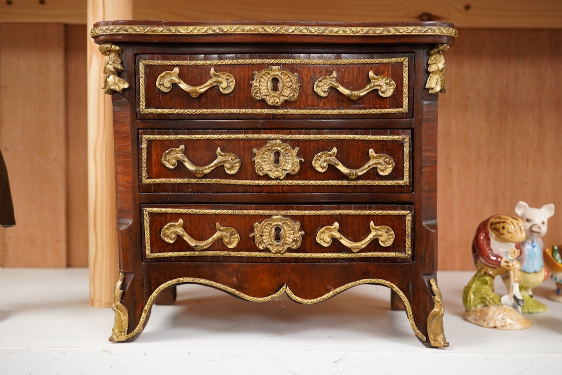 A 19th century French kingwood and gilt metal mounted miniature chest of drawers, 26cm wide x 24cm high